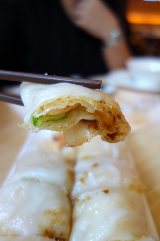 Steamed cheong fun rolled with crispy rice nest and seafood